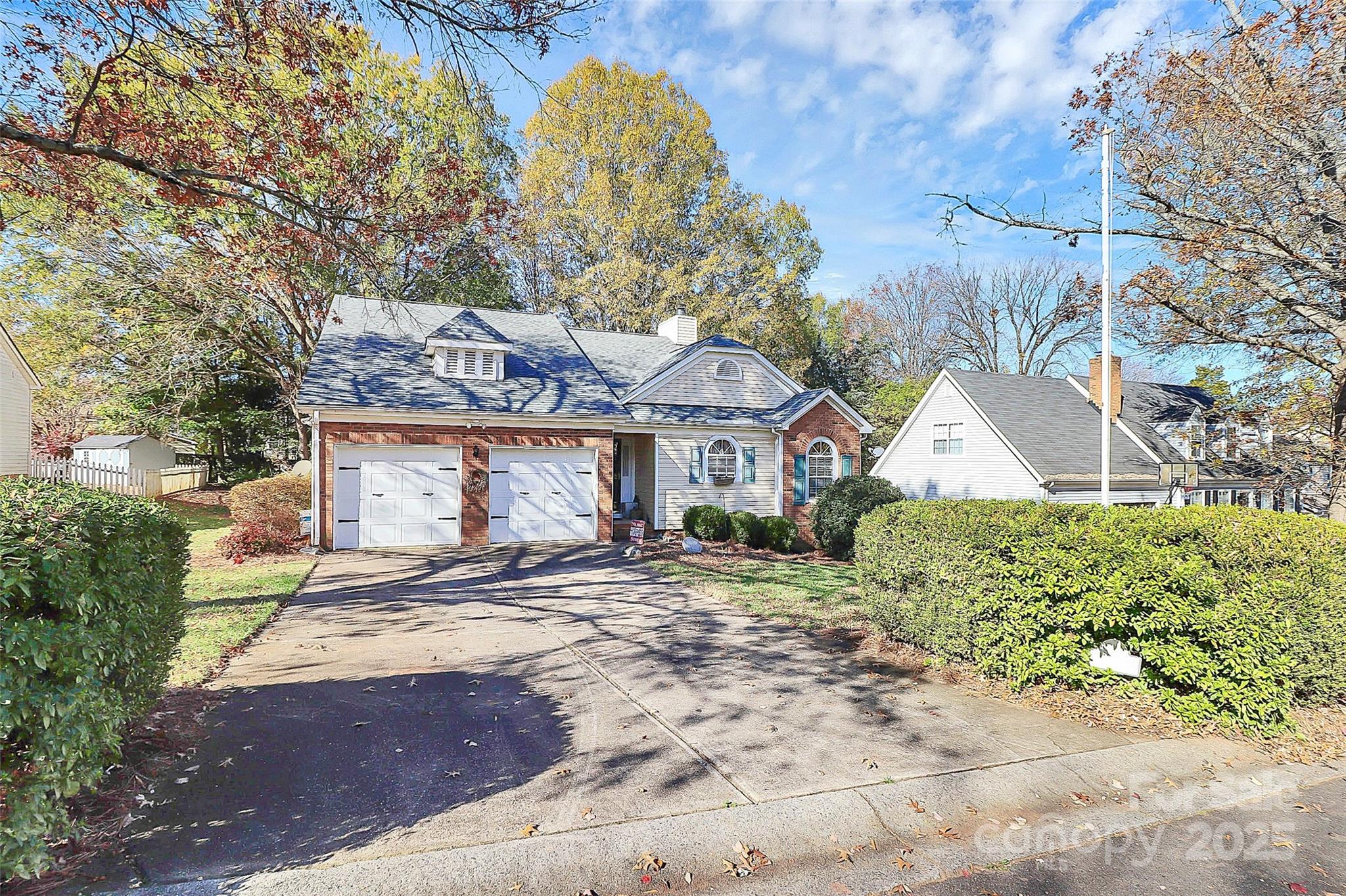 493 Debra Circle Southwest Concord, NC 28025 - Photo 2 of 27 a front view of a house with a yard and garage