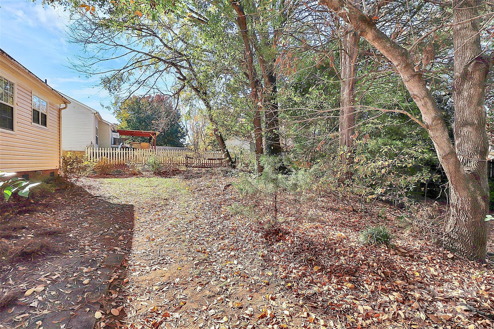 493 Debra Circle Southwest Concord, NC 28025 - Photo 25 of 27 a view of a yard with plants and trees
