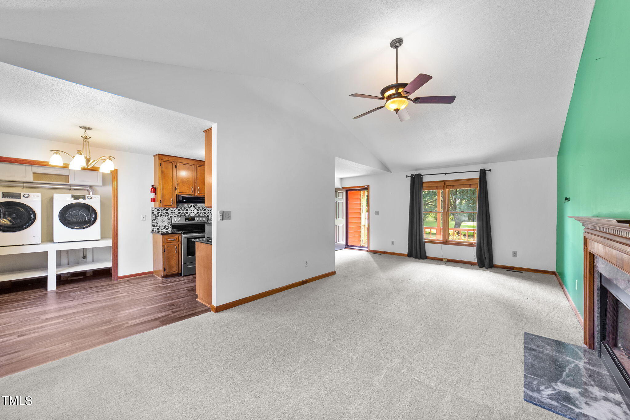 2712 Quail Point Drive Raleigh, NC 27603 - Photo 7 of 25 a view of a livingroom with furniture and a window