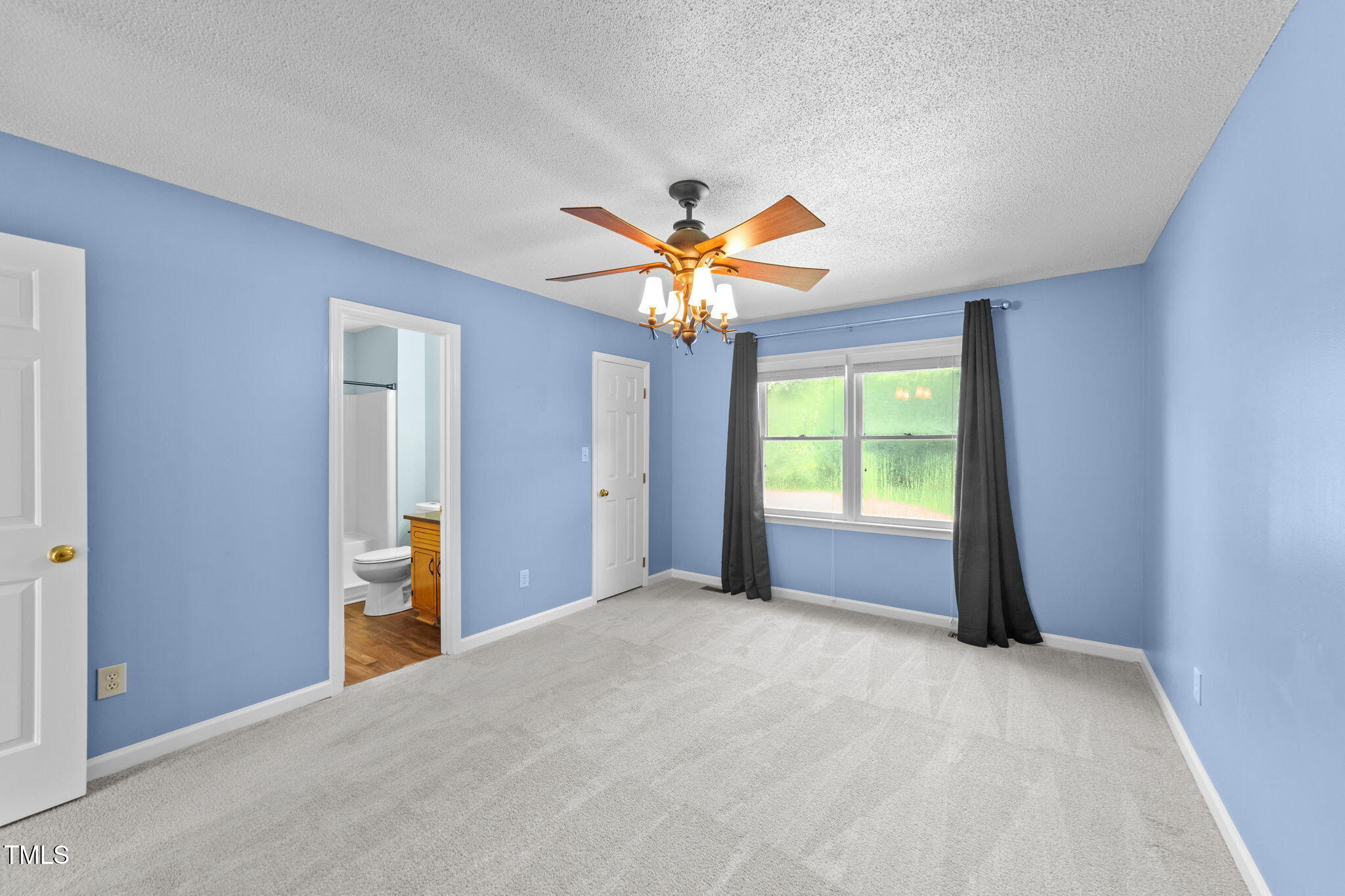2712 Quail Point Drive Raleigh, NC 27603 - Photo 9 of 25 a view of an empty room with a window