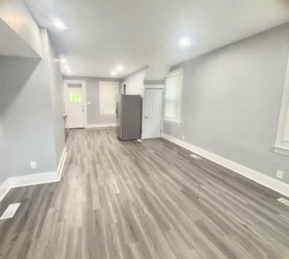 400 Prospect Street, Unit B Jeannette, PA 15644 - Photo 2 of 10 a view of an empty room with wooden floor and a window