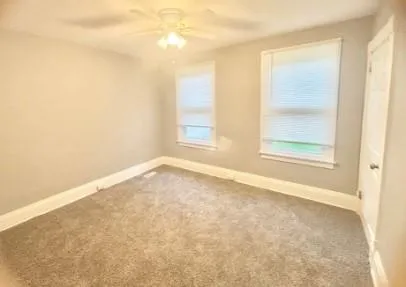 a white bath tub sitting next to a white toilet and sink