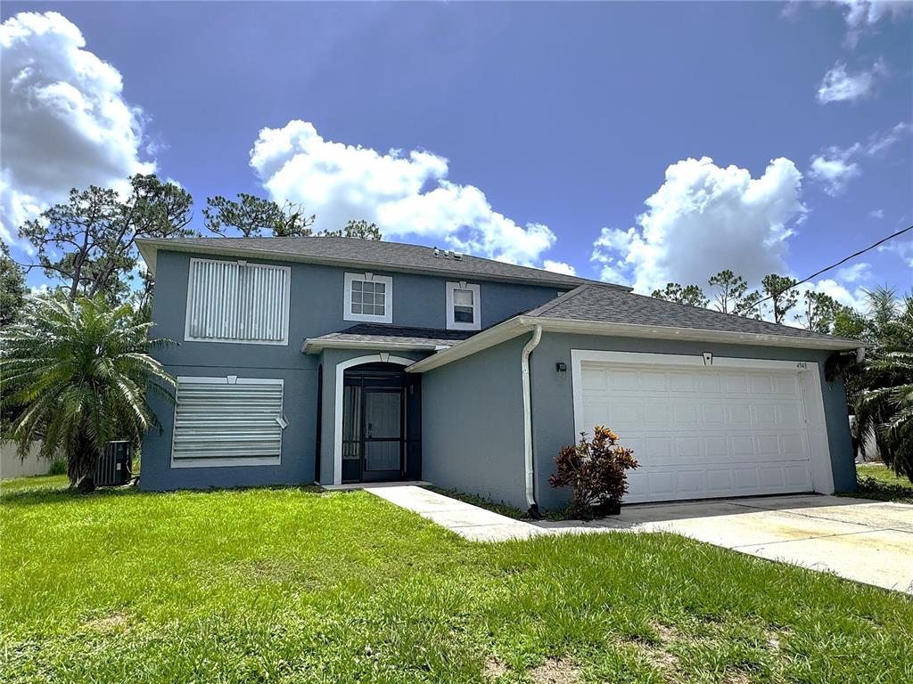 4948 Cromey Road North Port, FL 34288 - Photo 1 of 1 a view of a wooden house with a yard and a large window