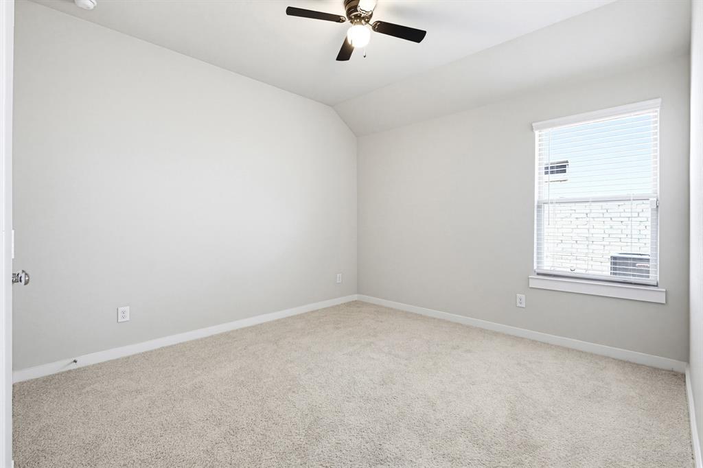 2108 Mossfield Lane Forney, TX 75126 - Photo 24 of 28 Bedroom with window facing the side of the house