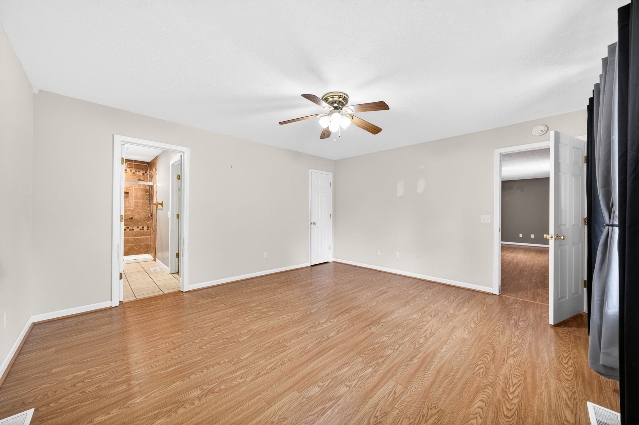291 Poplar Point Lane Rickman, TN 38580 - Photo 16 of 41 a view of empty room with wooden floor and fan