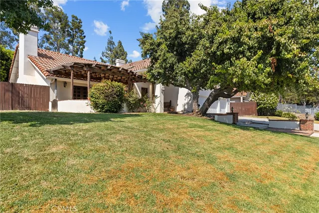 a view of a house with a yard and garage
