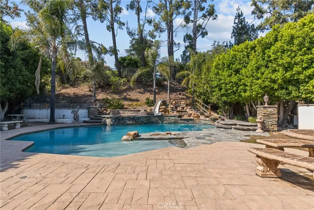 a view of a swimming pool with a patio