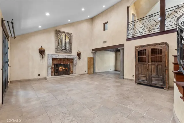 a view of an empty room with a fireplace