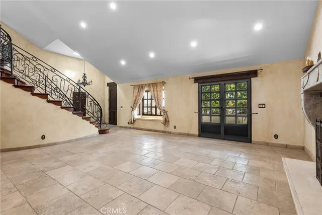 a view of an empty room with stairs