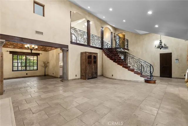 an entryway in a hall with a window
