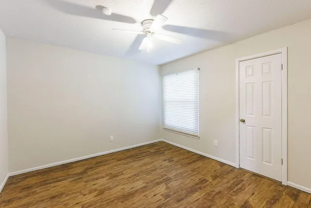 a view of a backyard with a small cabin and a chair