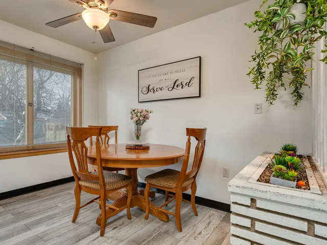 a view of a dining room with furniture window and wooden floor