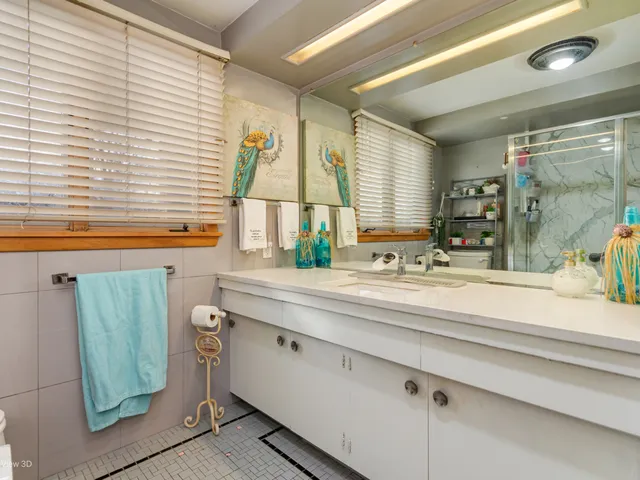a bathroom with a sink and a large mirror