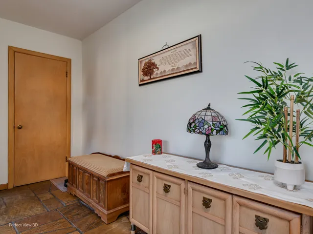 a kitchen with a potted plant on the counter
