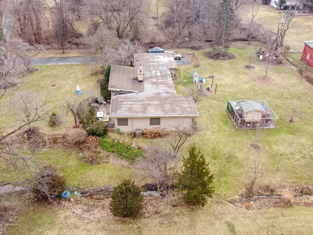 a aerial view of residential house with outdoor space