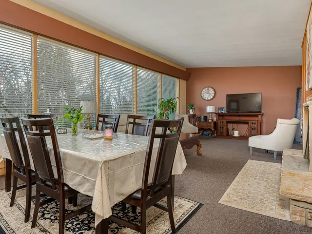 a view of a dining room with furniture window and outside view