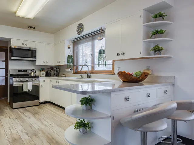 a kitchen with a table and chairs in it