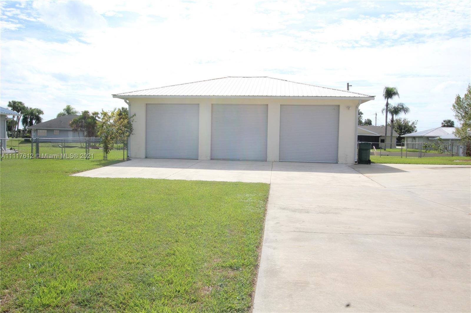 2009 Hunter Road Okeechobee, FL 34974 - Photo 5 of 43 a view of swimming pool with a yard and fence