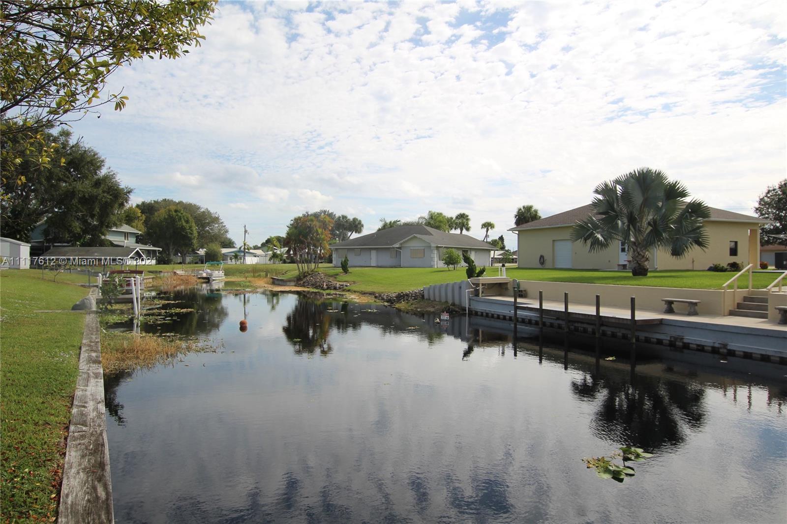2009 Hunter Road Okeechobee, FL 34974 - Photo 42 of 43 a view of residential houses with outdoor space and lake view