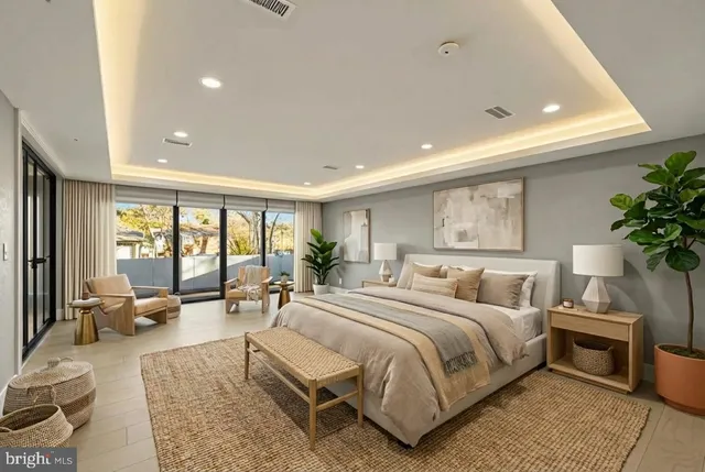 a spacious bedroom with a large bed and windows