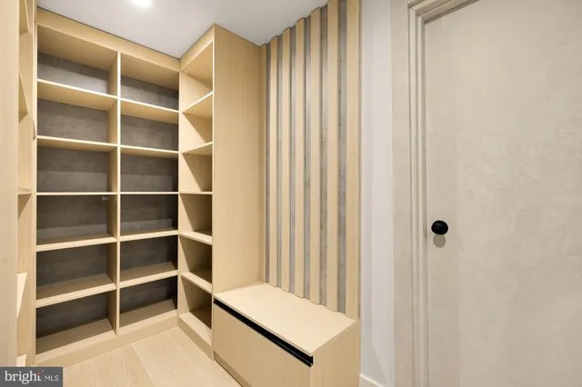 a view of bathroom with shower and a window