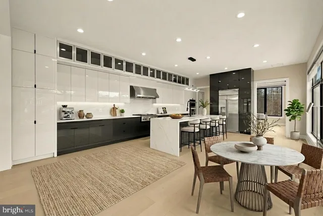 a kitchen with stainless steel appliances kitchen island granite countertop a sink and cabinets