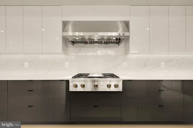 a kitchen with a stove and cabinets