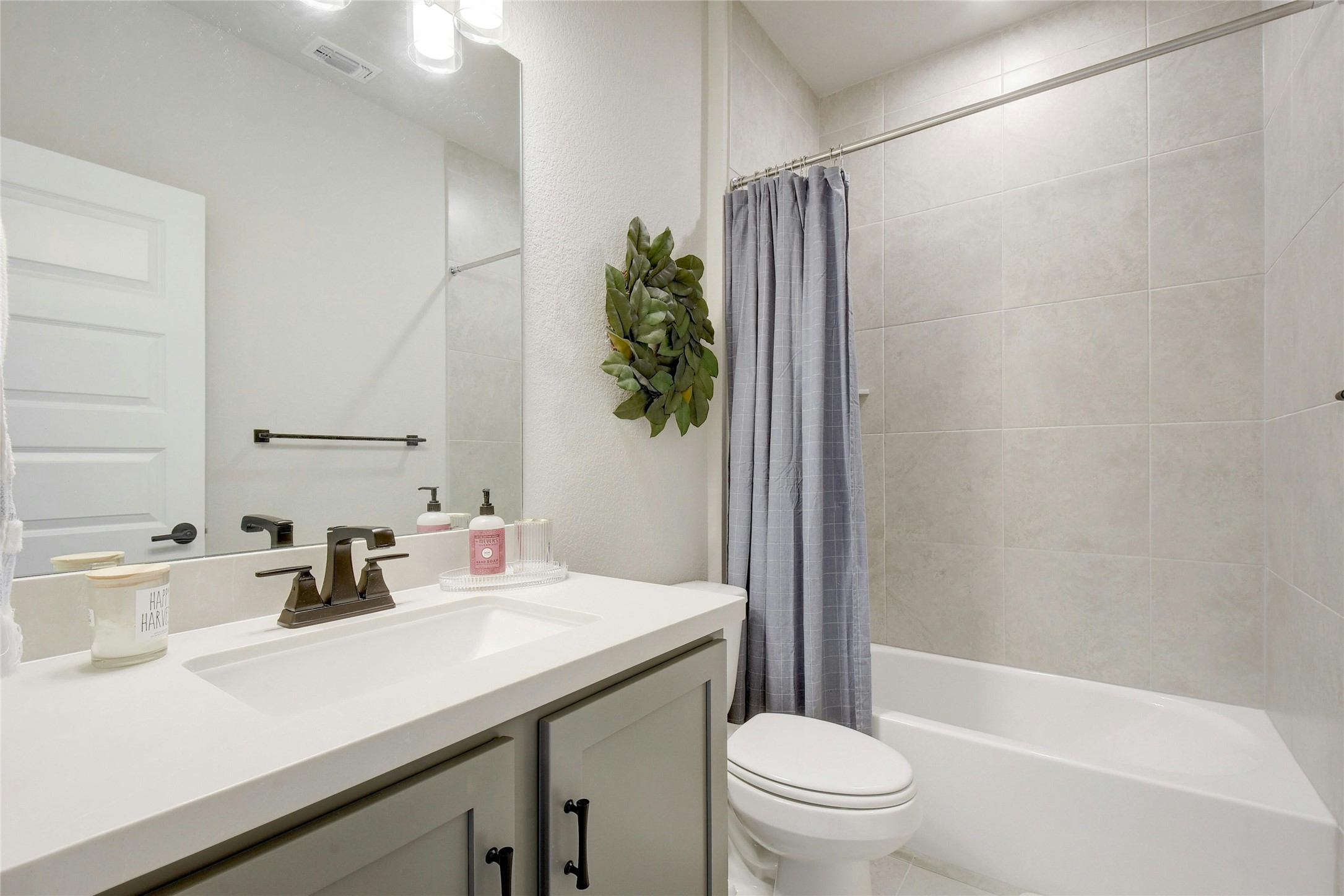 8302 Corrigan Pass Austin, TX 78744 - Photo 25 of 30 Full bathroom featuring vanity and shower / bath combo