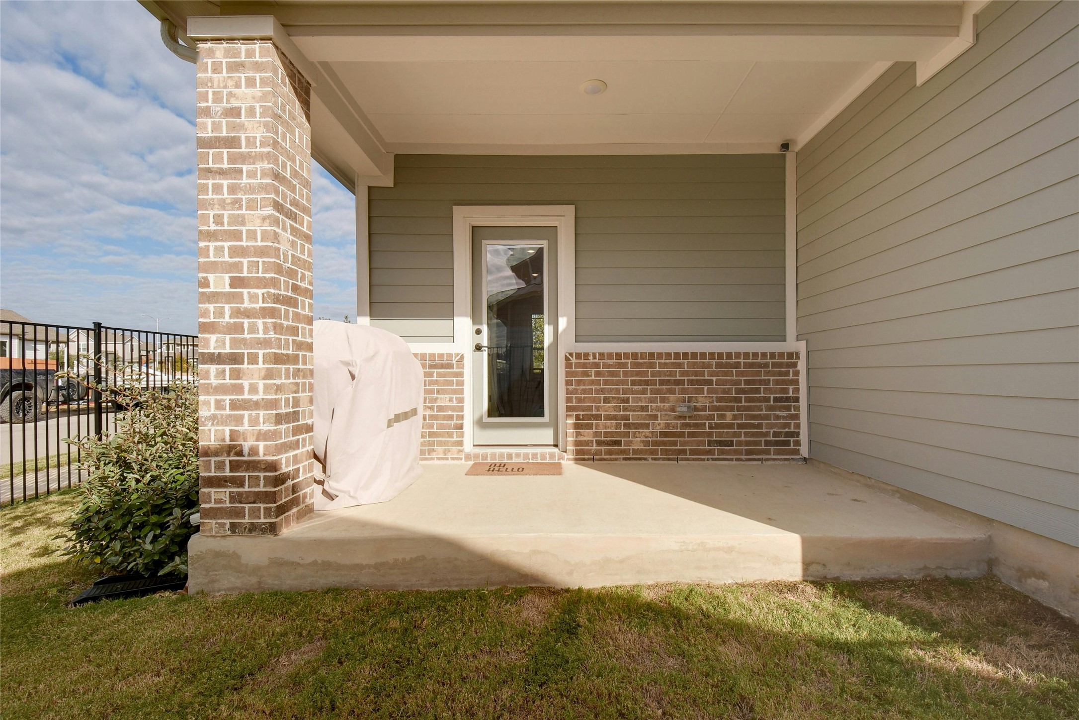 8302 Corrigan Pass Austin, TX 78744 - Photo 27 of 30 Entrance to property with a patio and brick siding