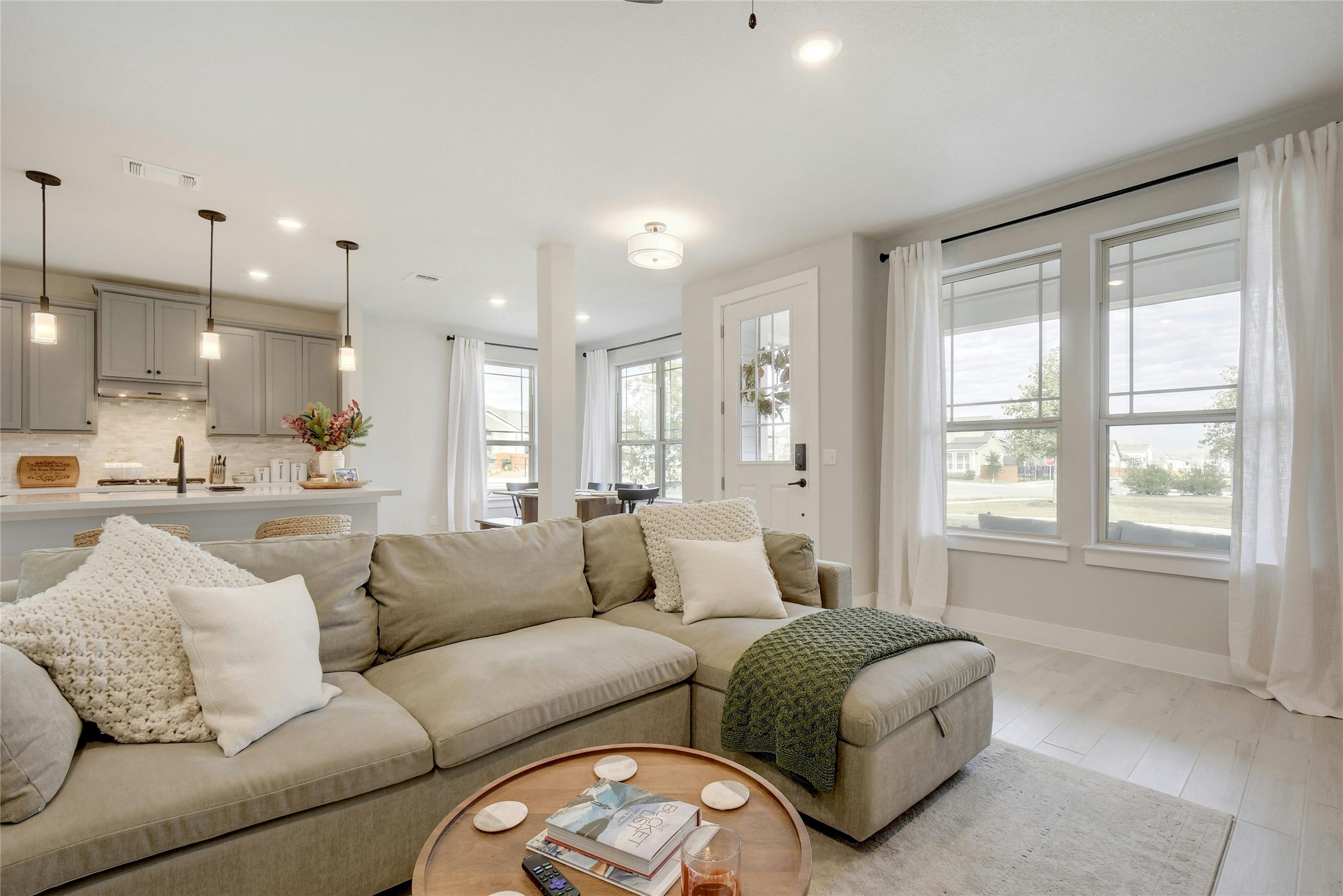 8302 Corrigan Pass Austin, TX 78744 - Photo 7 of 30 Living room featuring wood finished floors and recessed lighting