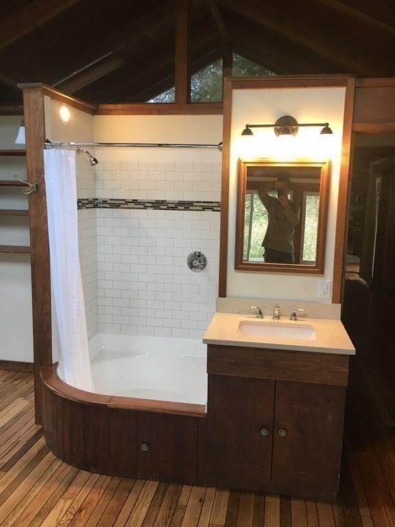 253 Long Plain Road Leverett, MA 01054 - Photo 13 of 42 a bathroom with a sink a mirror and a shower