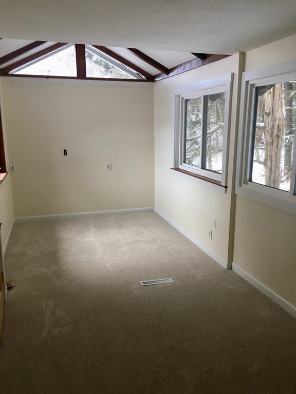 253 Long Plain Road Leverett, MA 01054 - Photo 14 of 42 en empty room with windows and closet