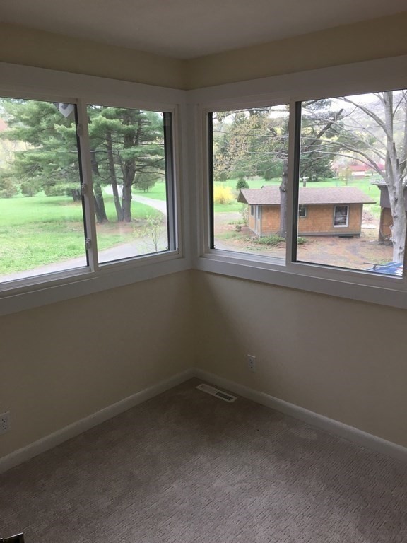 253 Long Plain Road Leverett, MA 01054 - Photo 17 of 42 an empty room with a window