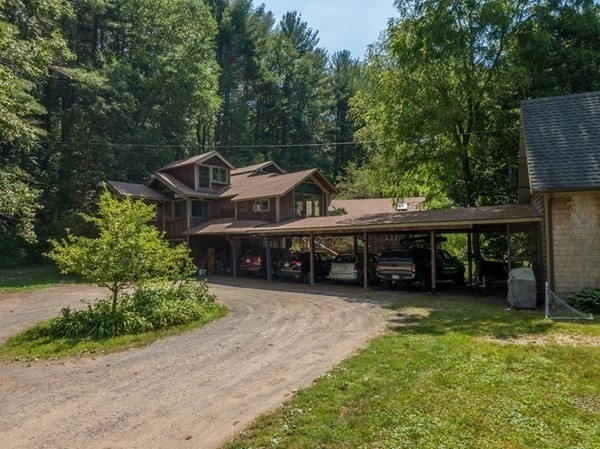 253 Long Plain Road Leverett, MA 01054 - Photo 2 of 42 a view of a house with a balcony and trees