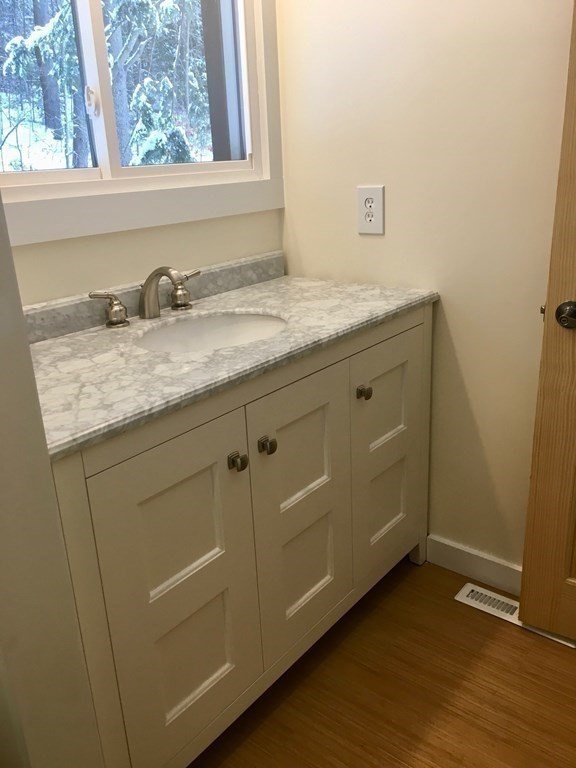 253 Long Plain Road Leverett, MA 01054 - Photo 22 of 42 a bathroom with a granite countertop sink and a window