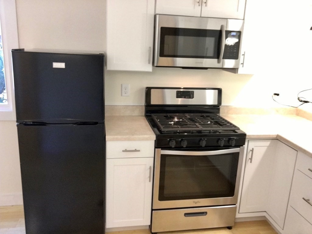 253 Long Plain Road Leverett, MA 01054 - Photo 27 of 42 a kitchen with stainless steel appliances and cabinets