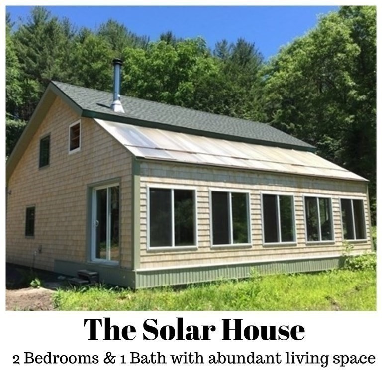 253 Long Plain Road Leverett, MA 01054 - Photo 30 of 42 a view of a house with a small yard