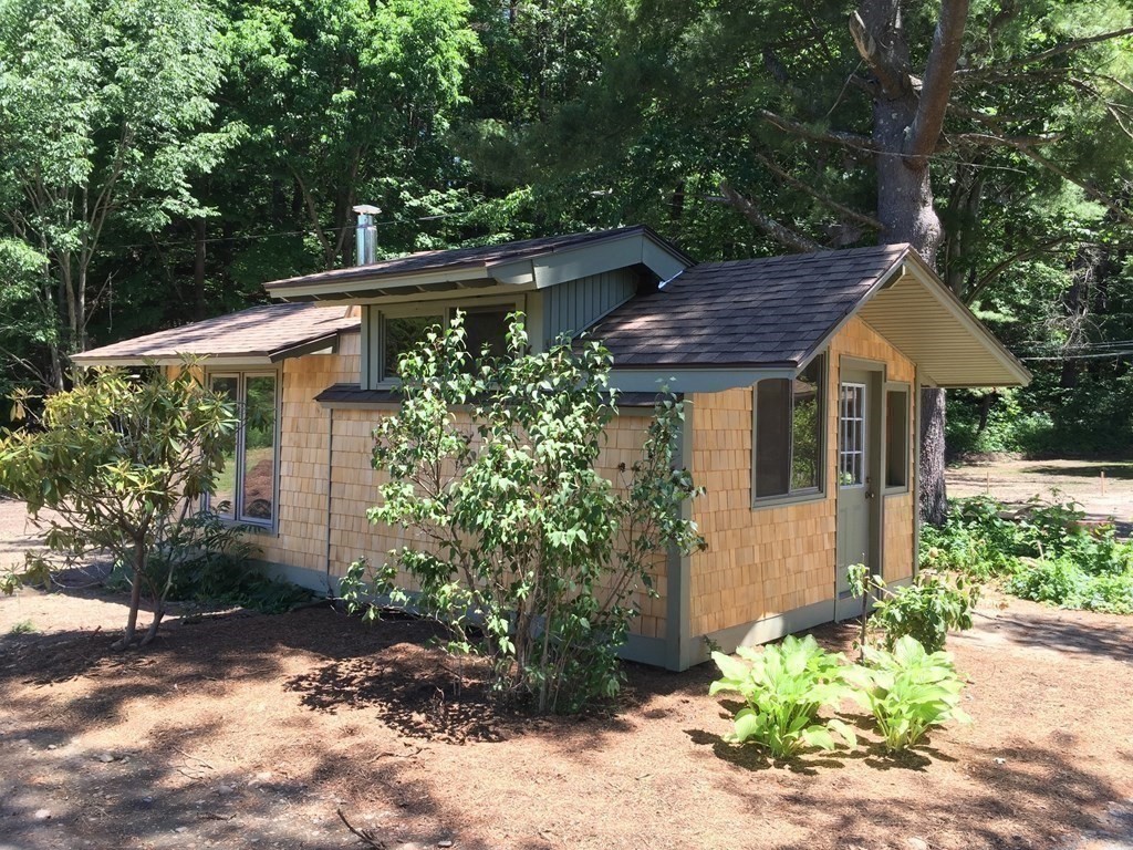 253 Long Plain Road Leverett, MA 01054 - Photo 41 of 42 a view of a house with a yard and potted plants