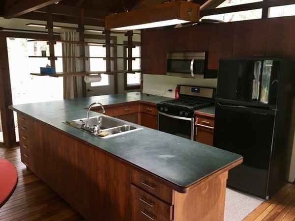 253 Long Plain Road Leverett, MA 01054 - Photo 8 of 42 a kitchen with a stove a sink and a refrigerator