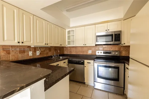 a kitchen with a stove and a microwave