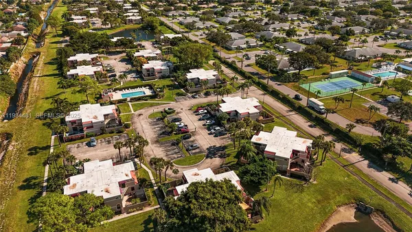 an aerial view of residential houses with outdoor space