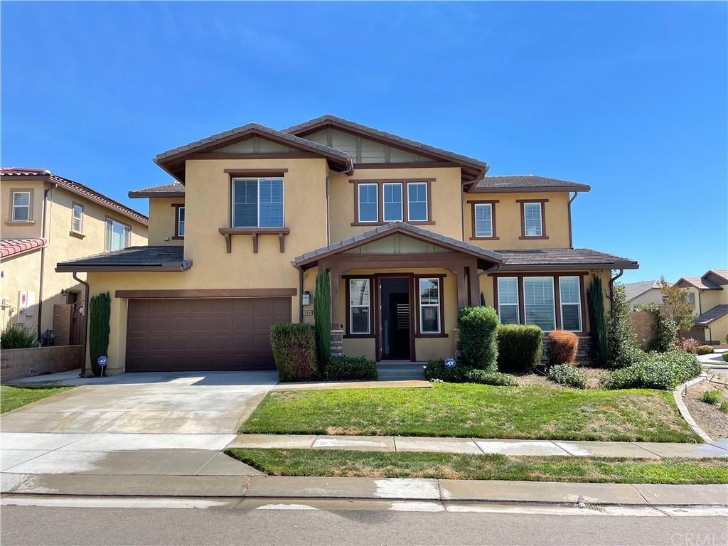 10944 Playa Del Sol Riverside, CA 92503 - Photo 1 of 1 a front view of a house with a yard and garage