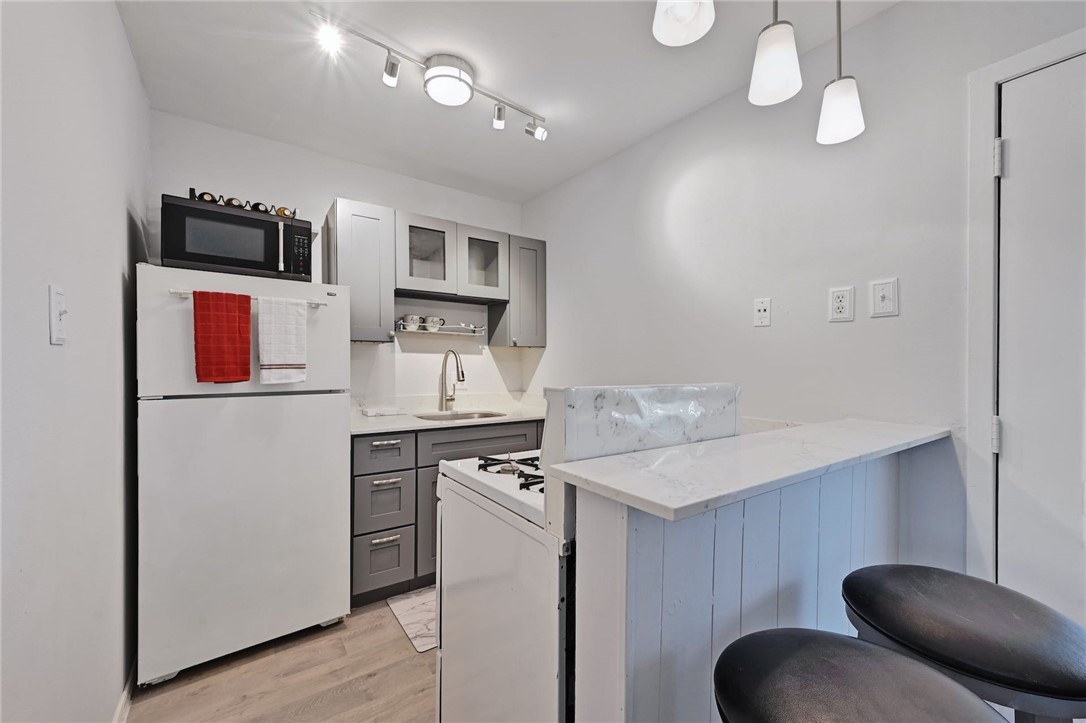 1111 West 10th Street, Unit 204 Austin, TX 78703 - Photo 4 of 19 Kitchen area - current refrigerator is newer, stainless steel
