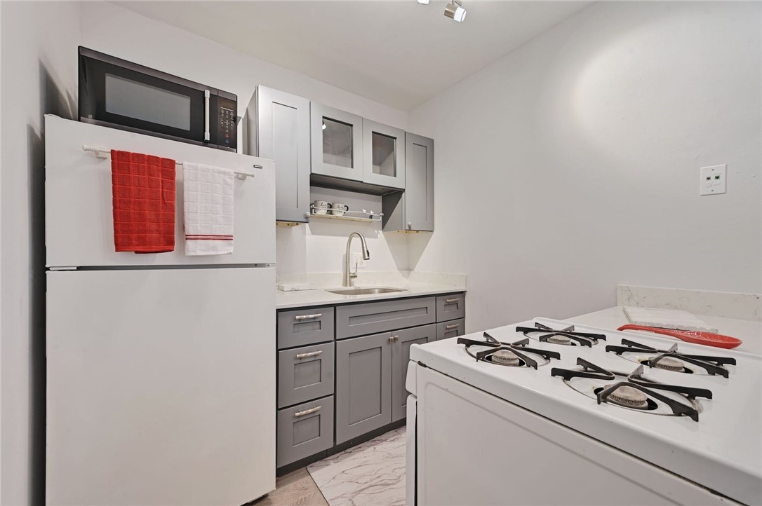 1111 West 10th Street, Unit 204 Austin, TX 78703 - Photo 5 of 19 Kitchen area - current refrigerator is newer, stainless steel