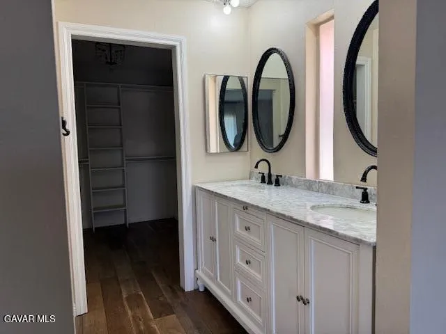 an empty room with wooden floor and a window