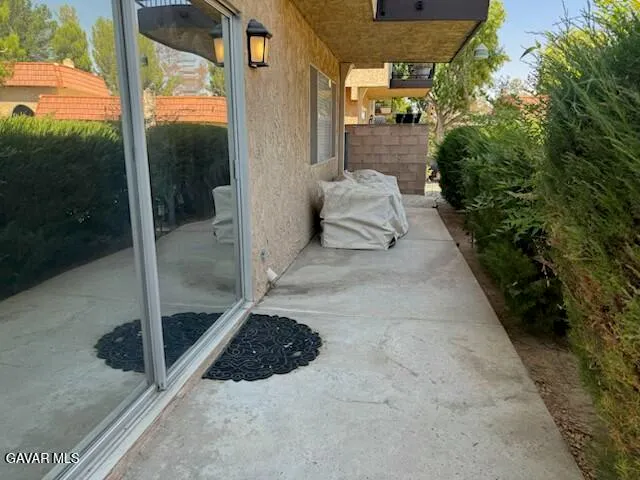 a view of balcony with furniture