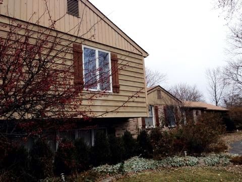 688 Milton Road Inverness, IL 60067 - Photo 2 of 13 a front view of a house with a yard