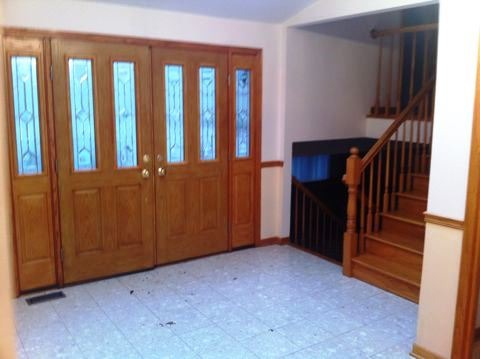 688 Milton Road Inverness, IL 60067 - Photo 4 of 13 a view of an entryway with staircase