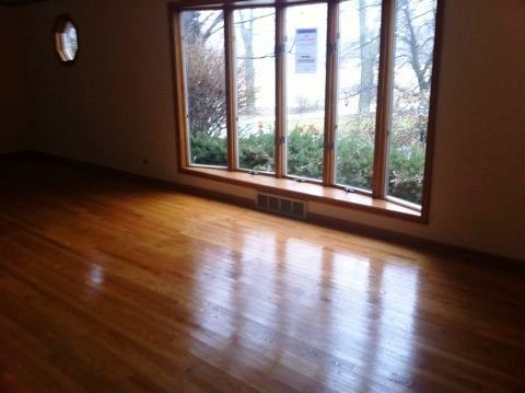 688 Milton Road Inverness, IL 60067 - Photo 6 of 13 a view of an empty room with wooden floor and a window