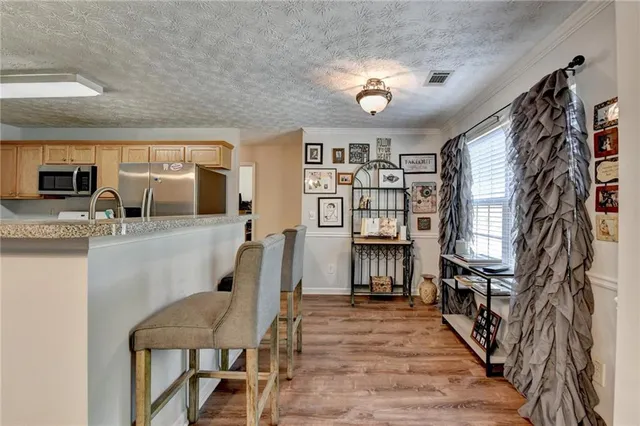 a living room with fireplace furniture and a flat screen tv